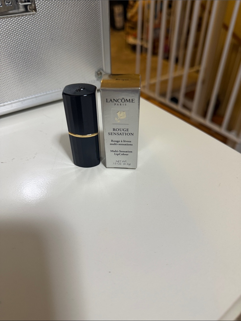Lancôme Rouge Sensation Lipstick - Black & Gold Accents shade is called Bisque